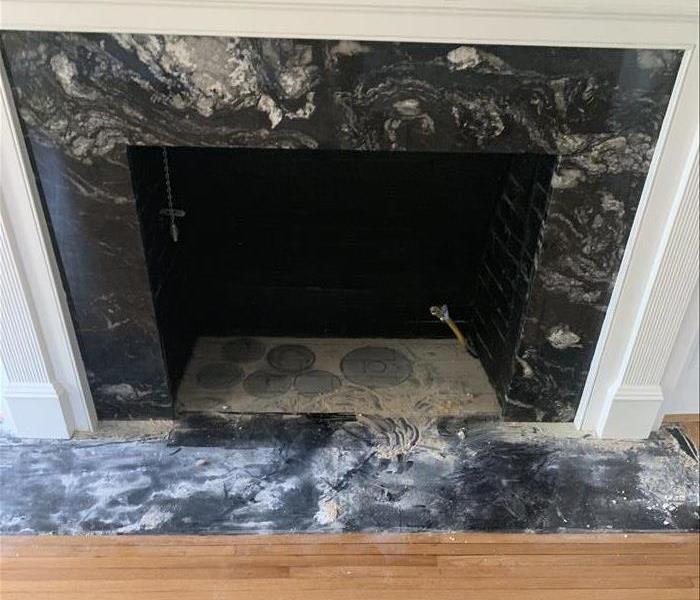 Water Damage to a fireplace after a tree went through a home after a Storm