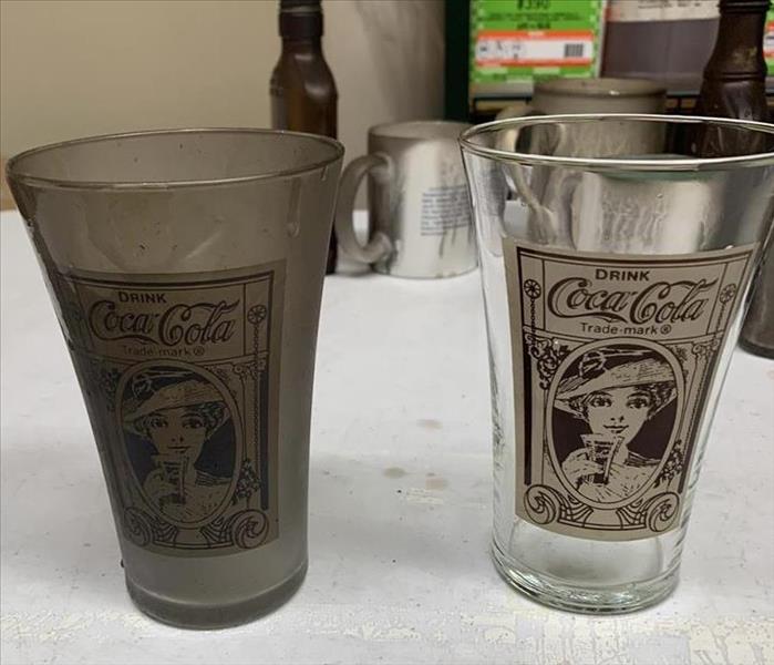 Vintage Coco-cola glasses covered in Soot Residue after a fire and after they were cleaned by the SERVPRO team