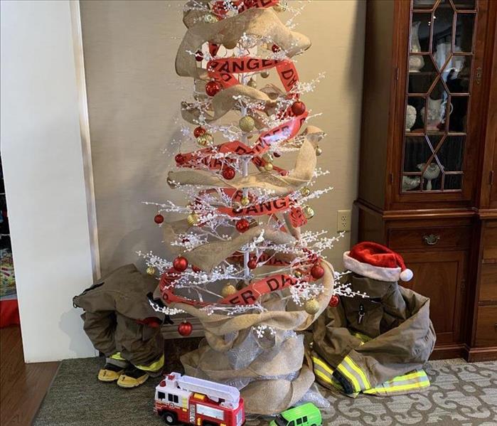 SERVPRO's "Not All Heros Wear Capes" tree decorations competed for the Festival of Tress at Woodbridge of Clinton. SC
