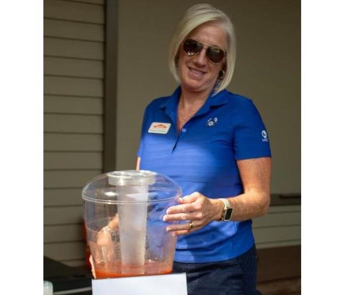 Owner Kimberly Kitchens serving up Bloody Mary's for the Annual Golf Tournament 