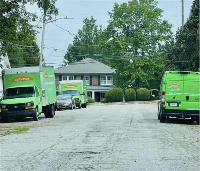 SERVPRO trucks lining the streets in a neighborhood in Newberry