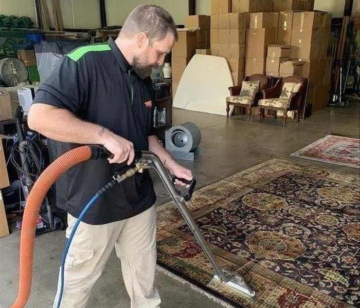 SERVPRO technician cleaning a rug in Newberry, SC